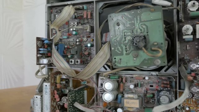 Interior electronics of old analog TV. Slider shot
