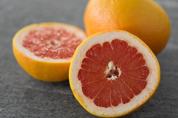 food, fruits and healthy eating concept - close up of fresh juicy grapefruits