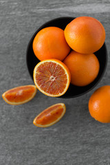 food, fruits and healthy eating concept -close up of fresh juicy blood oranges