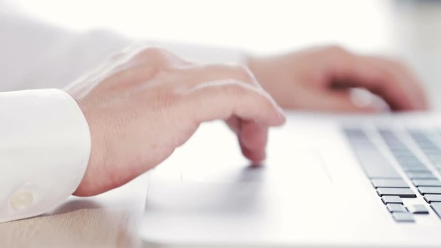 businessman surfing the web using his trackpad