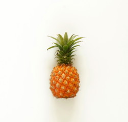 Fruit Pineapples top view on white background. Copy space. Creative fruits background.