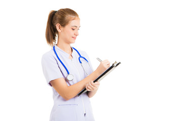 Hands of medical nurse holding silver pen writing on clipboard closeup. Medical care