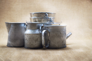 Metal zinc bucket and bottle with sack background