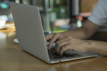 Young businessman working on a notebook.
