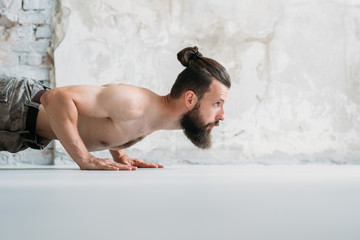 man doing push ups. fitness and bodybuilding. sport and physical activity.