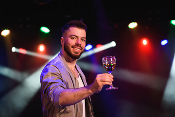 Man offering champagne and flirting at party