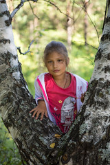 Little girl on a walk in the woods
