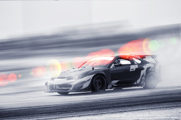 Car drifting, Blurred of image diffusion race drift car with lots of smoke from burning tires on...
