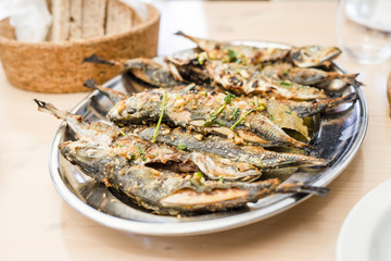 Silver tray full of delicious fish mackerel known as carapau in Portugal