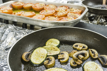 Vegetarian delicious food: zucchini, mushrooms and tomatoes