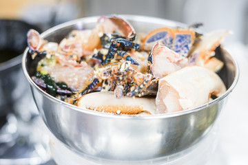 Colorful lobsters in a silver bowl