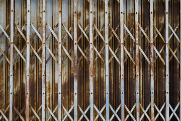 Rusty steel collapsible door texture, old fashion style shutter gate