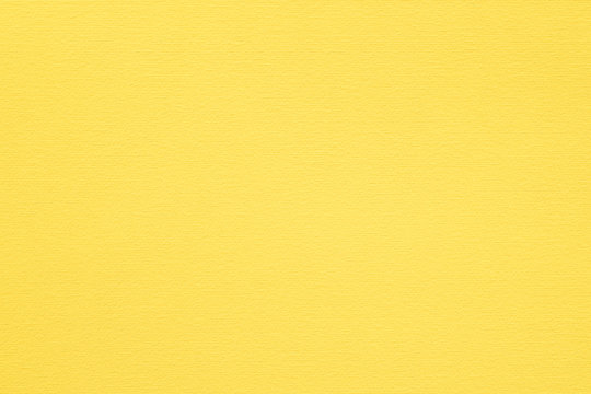 yellow paper texture background. colored cardboard fibers and grain. empty space concept.