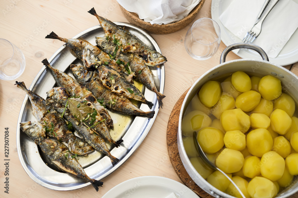 Wall mural Silver tray full of delicious fish mackerel known as carapau in Portugal