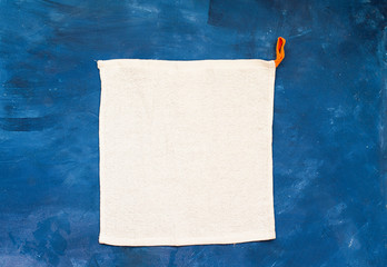 white towel on blue background . White Spa towels on blue background, top view