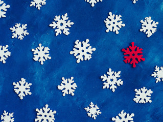 white snowflakes homemade on blue background, winter, place for text