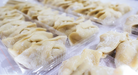 Fototapeta na wymiar Uncooked Raw Chinese Style Dumpling with Flour
