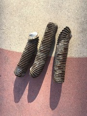 Three screws on a colorful painted wall in Mexico 
