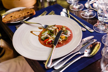 Meal with dressing and sauce on the dish in restaurant