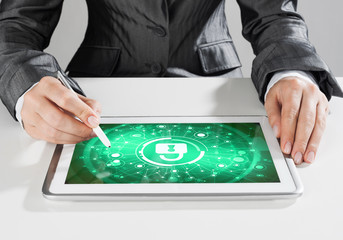 Internet security concept with woman working on media screen with stylus