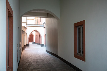 Undercover cobbled passage leading to a courtyard