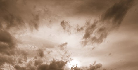 Dramatic clouds with sepia filter - obrazy, fototapety, plakaty