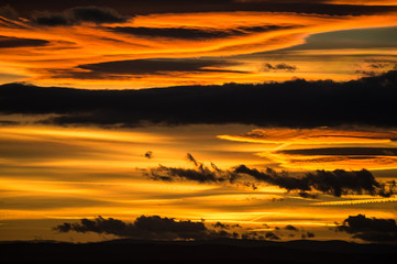Fototapeta na wymiar dramatic dark clouds in the sky at sunset