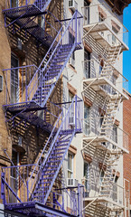 Fototapeta premium Fire escapes in New York, one of the city symbols, USA.