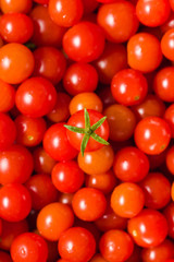 Fresh Small Red Cherry Tomato In The Center. Shallow Depth Of Field. Top View. Background. Vertical Version.