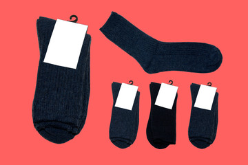 five pairs of new warm socks on red background
