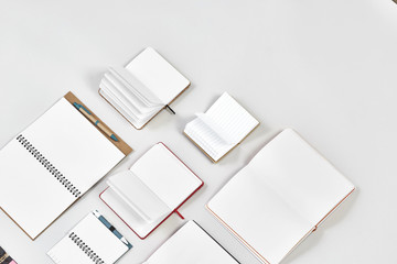 Mock up of Many open notebooks in grey background