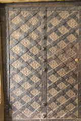 Old forged, antique door in the Cistercian abbey in Wachock