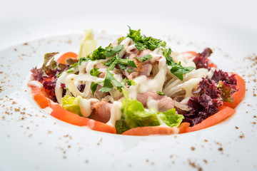 Chicken salad, Salad with meat and tomato on a plate