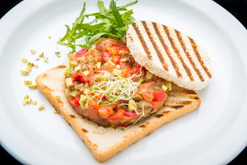 Bruschetta with tomato, mozarella and basil