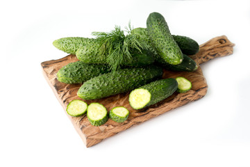 cucumbers and dill on a plate isolated on white