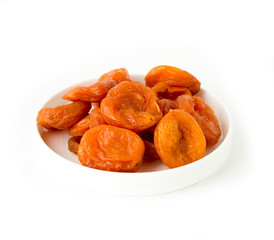 dried apricots in a bowl isolated on white