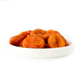 dried apricots in a bowl isolated on white