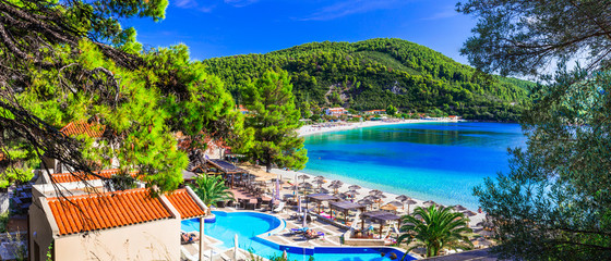 Fototapeta premium Greek holidays - beautiful Panormos bay. view with hotel and beach. Skopelos island