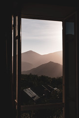 Maritime Alps room with a view - layers of mountains at sunset viewed from a window