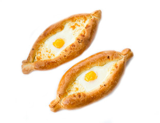 Traditional Georgian pastries. Adjarian khachapuri with egg isolated on white background.