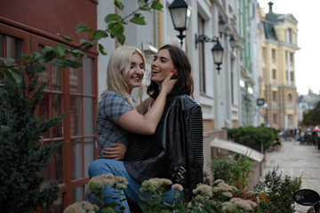 Happy positive attractive lesbian couple. Going to kiss. Samesex love concept.
