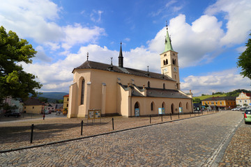 Naklejka premium view of the square and the church in Kašperské hory