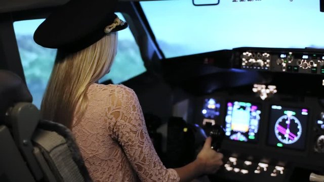 The Young blonde women controls the passenger plane