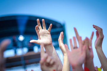 Hand fans during a concert. Open air festival