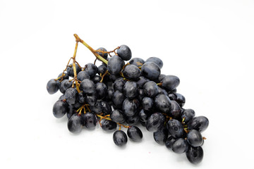 Black grapes and white background