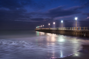 Durban beach  in South Africa - Blue Hour - overlooking the Indian ocean. sea waves dancing over the magic sunset light 