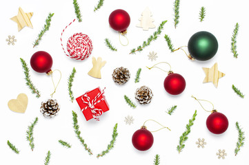 Christmas composition. New Year's wooden toys, fir cones, fir branches, gift twine, red gift,...
