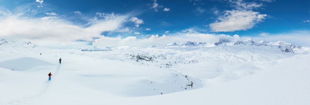 Group of skialpinists walking in Alpine landscape