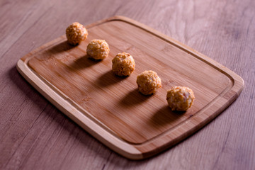 Tasty cheese balls served in the wooden plate