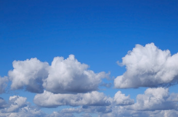 Naklejka na ściany i meble Clouds against blue sky. Blue sky and white clouds.